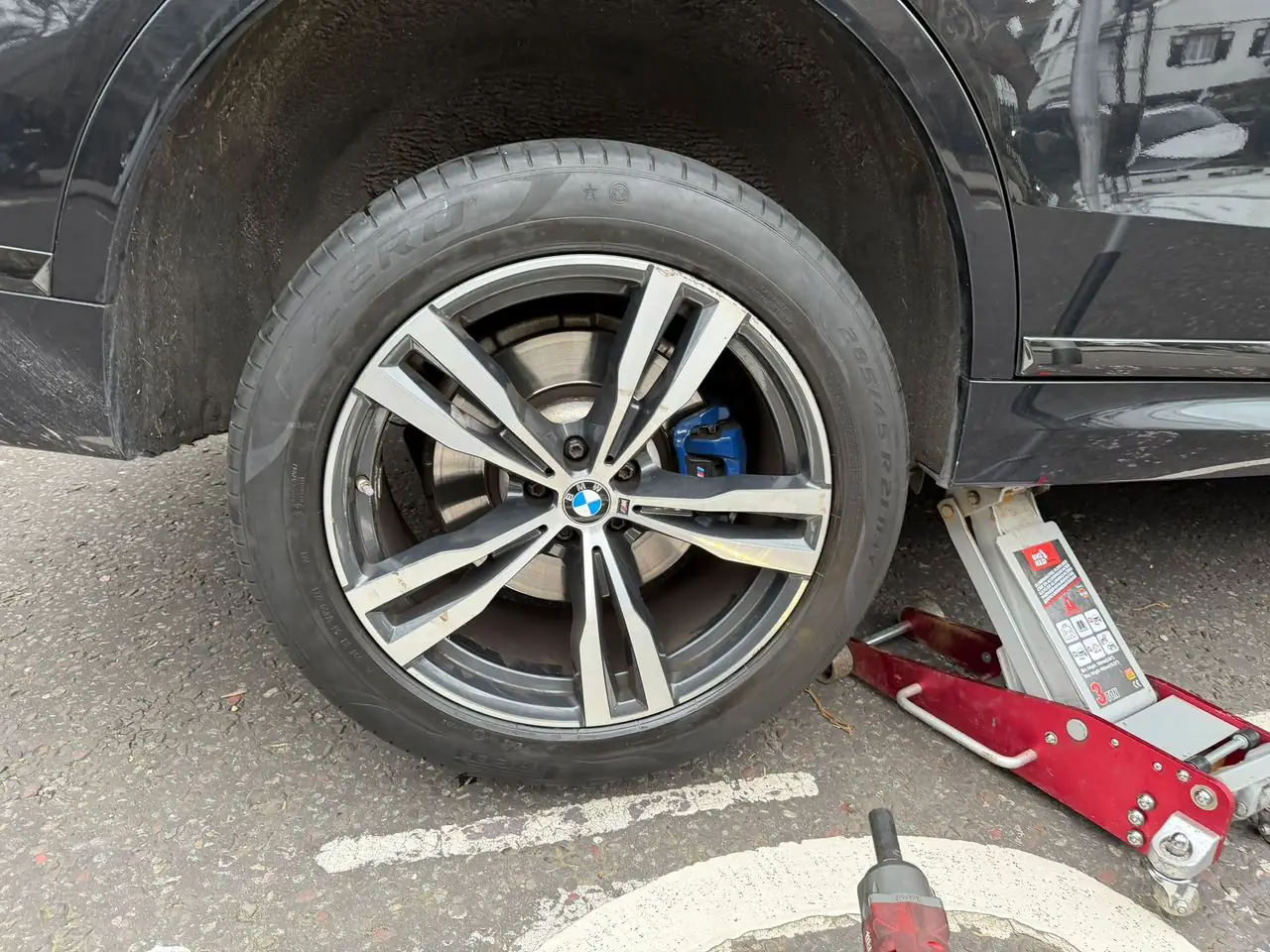 Roadway Assist technician performing a professional wheel change in Coventry