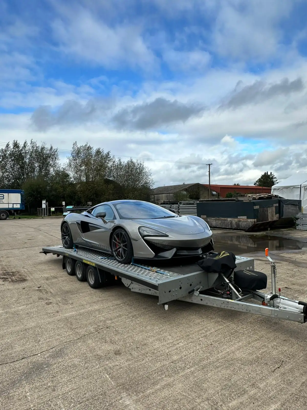 McLaren 570S loaded on a Roadway Assist flatbed for transport
