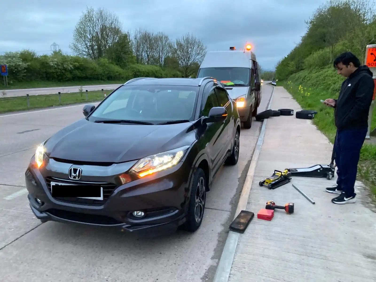 Roadway Assist mobile tyre fitter fitting a tyre at a customers home